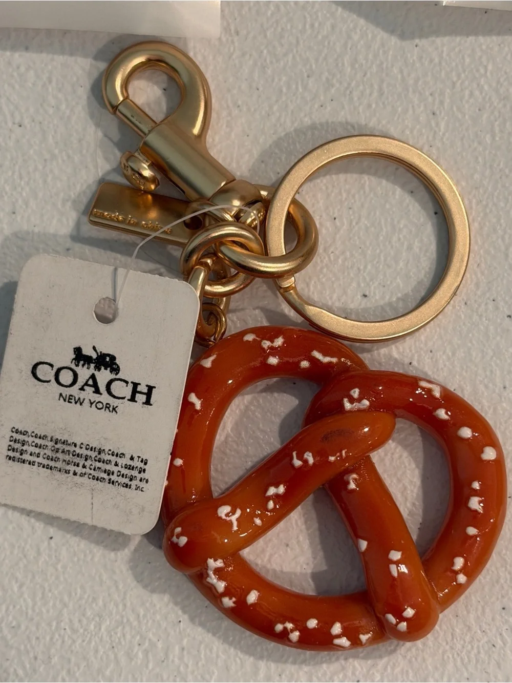 COACH Gold-Tone Key Ring with Orange Pretzel Charm